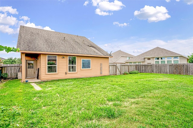 8138 Heartbrook Field Ln, Cypress, TX 77433 - back of house featuring a fenced backyard and a shingled roof