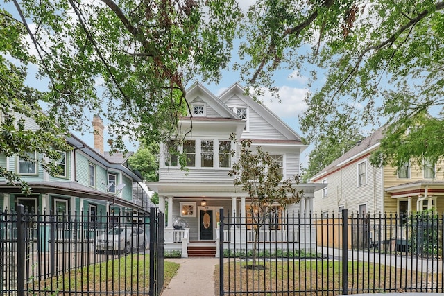 412 Hawthorne St, Houston, TX 77006 - view of front facade featuring a fenced front yard and covered porch