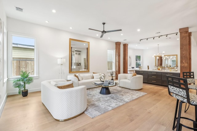 412 Hawthorne St, Houston, TX 77006 - living room featuring decorative columns, a ceiling fan, light wood-style floors, and recessed lighting