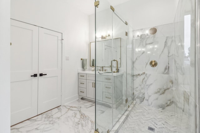 412 Hawthorne St, Houston, TX 77006 - full bathroom with a marble finish shower, vanity, marble look tile flooring, and baseboards