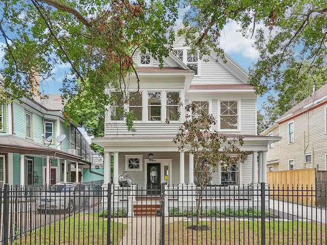 412 Hawthorne St, Houston, TX 77006 - view of front of house featuring covered porch and a fenced front yard