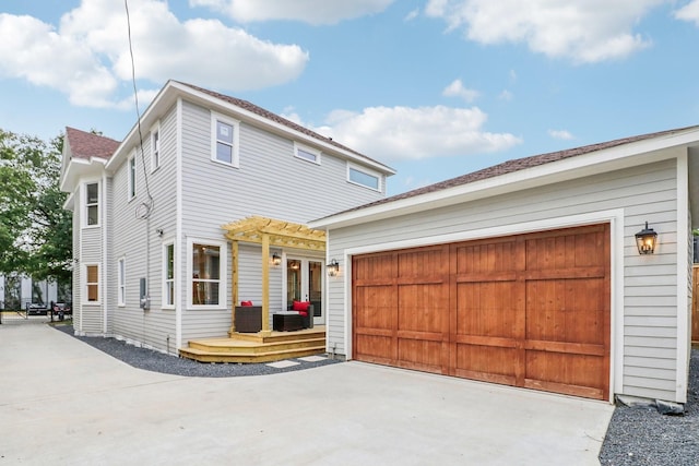 412 Hawthorne St, Houston, TX 77006 - view of front facade featuring concrete driveway, a pergola, and a wooden deck
