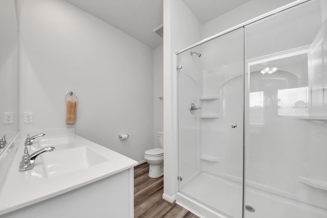1110 Bending Trail Dr, Tomball, TX 77375 - full bath with toilet, a shower stall, wood finished floors, and vanity