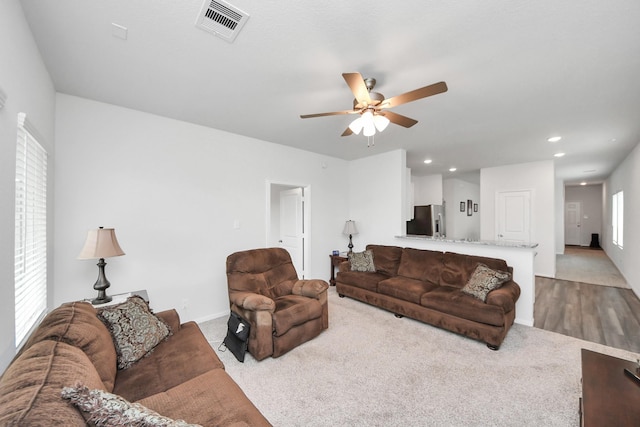 1110 Bending Trail Dr, Tomball, TX 77375 - living area with ceiling fan, healthy amount of natural light, carpet floors, recessed lighting, and baseboards