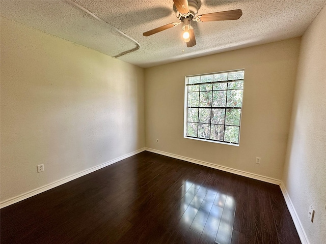 2750 Holly Hall St Unit 1215, Houston, TX 77054 - empty room featuring a textured ceiling, a ceiling fan, and dark wood-type flooring