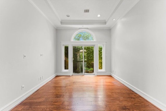 44 Vinebrook Rd, The Woodlands, TX 77380 - unfurnished room with hardwood / wood-style flooring, a raised ceiling, crown molding, baseboards, and recessed lighting