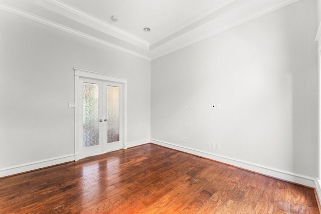44 Vinebrook Rd, The Woodlands, TX 77380 - empty room with french doors, wood finished floors, crown molding, and baseboards