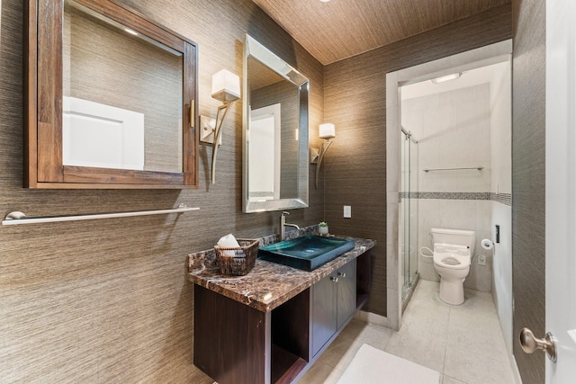 44 Vinebrook Rd, The Woodlands, TX 77380 - full bathroom with tile patterned floors, a stall shower, toilet, and vanity