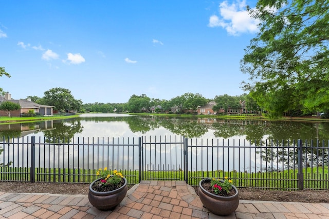44 Vinebrook Rd, The Woodlands, TX 77380 - view of patio featuring a water view