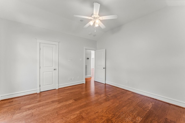 44 Vinebrook Rd, The Woodlands, TX 77380 - unfurnished bedroom featuring lofted ceiling, wood finished floors, baseboards, and ceiling fan