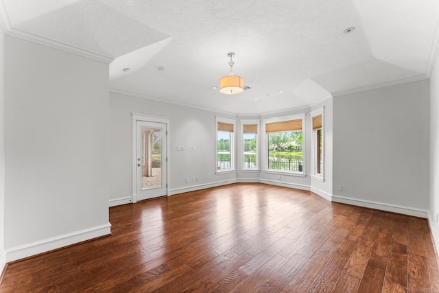 44 Vinebrook Rd, The Woodlands, TX 77380 - empty room featuring crown molding, hardwood / wood-style floors, and baseboards