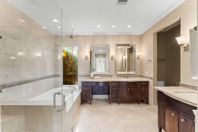 44 Vinebrook Rd, The Woodlands, TX 77380 - full bathroom featuring two vanities, crown molding, a garden tub, recessed lighting, and a shower stall