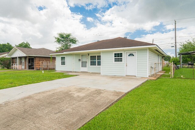 1418 Harris Ave, Pasadena, TX 77506 - rear view of property with concrete driveway and a patio