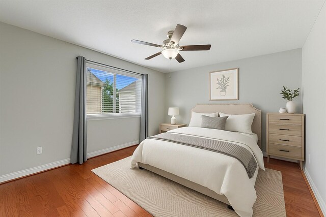 1646 W 13th St, Houston, TX 77008 - bedroom featuring wood finished floors, baseboards, and ceiling fan