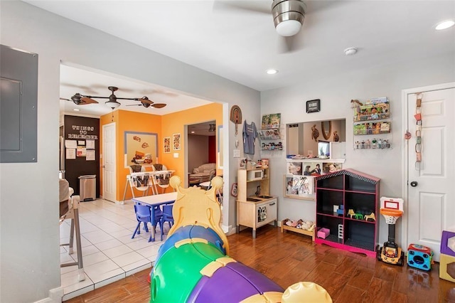 5302 Treaschwig Rd, Spring, TX 77373 - recreation room featuring a ceiling fan, electric panel, wood finished floors, and recessed lighting
