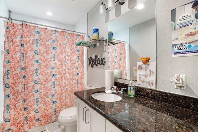 5302 Treaschwig Rd, Spring, TX 77373 - full bath featuring toilet, vanity, curtained shower, recessed lighting, and a textured wall