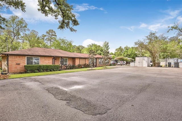 5302 Treaschwig Rd, Spring, TX 77373 - ranch-style house featuring a carport and brick siding
