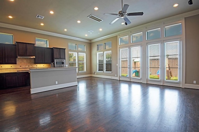 9948 Woodwind Ln N, Houston, TX 77025 - unfurnished living room with ornamental molding, recessed lighting, dark wood-style floors, ceiling fan, and baseboards