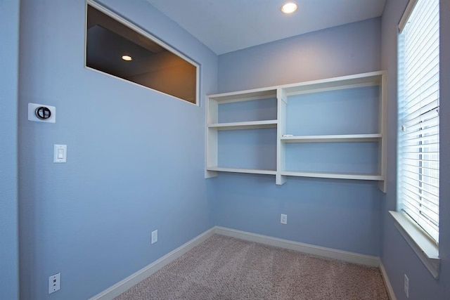 9948 Woodwind Ln N, Houston, TX 77025 - carpeted spare room with baseboards, plenty of natural light, and recessed lighting