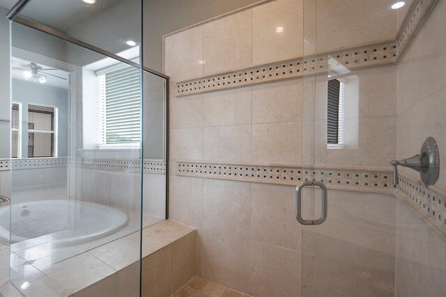 9948 Woodwind Ln N, Houston, TX 77025 - bathroom with a shower stall, a bath, and ceiling fan