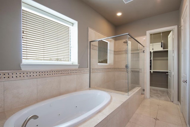 9948 Woodwind Ln N, Houston, TX 77025 - bathroom with a stall shower, a tub with jets, tile patterned flooring, recessed lighting, and a spacious closet