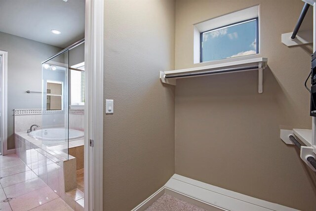 9948 Woodwind Ln N, Houston, TX 77025 - spacious closet featuring light tile patterned flooring