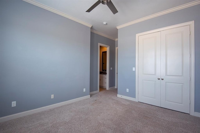 9948 Woodwind Ln N, Houston, TX 77025 - unfurnished bedroom featuring crown molding, baseboards, carpet flooring, a closet, and a ceiling fan