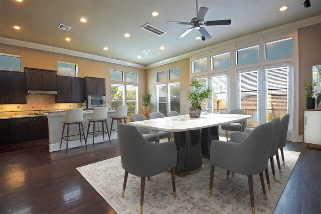 9948 Woodwind Ln N, Houston, TX 77025 - dining area with crown molding, dark wood-type flooring, a ceiling fan, and recessed lighting