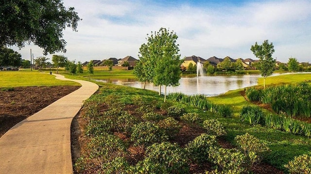 7439 Denali Dr, Katy, TX 77493 - surrounding community with a water view, a lawn, and a residential view
