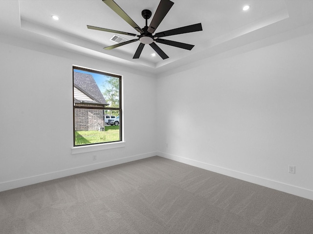 17107 Alara Dr, Splendora, TX 77372 - carpeted spare room with a tray ceiling, recessed lighting, baseboards, and ceiling fan