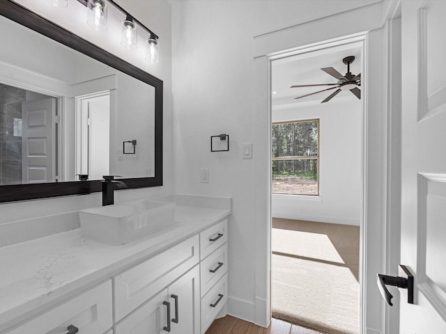 17107 Alara Dr, Splendora, TX 77372 - bathroom featuring vanity, a ceiling fan, and baseboards