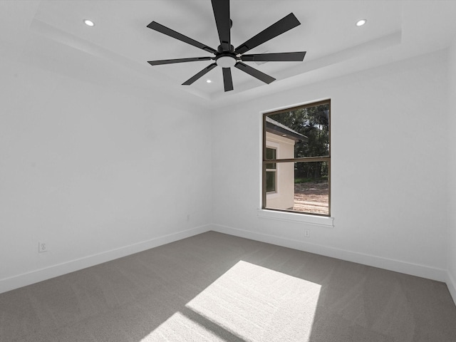 17107 Alara Dr, Splendora, TX 77372 - carpeted spare room featuring a raised ceiling, recessed lighting, baseboards, and ceiling fan