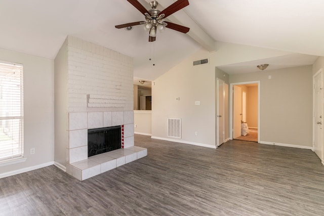 6930 Caddo Lake Ln, Houston, TX 77083 - unfurnished living room featuring ceiling fan, wood finished floors, a fireplace, and healthy amount of natural light