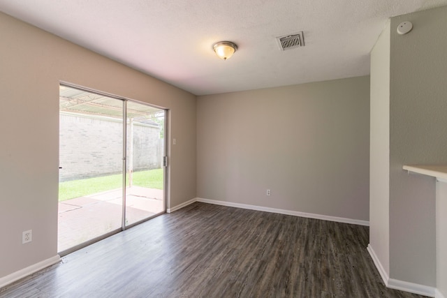 6930 Caddo Lake Ln, Houston, TX 77083 - unfurnished room with dark wood finished floors and a smoke detector