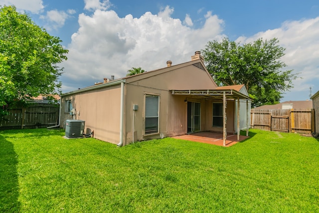 6930 Caddo Lake Ln, Houston, TX 77083 - back of house with a fenced backyard, a patio area, and a chimney