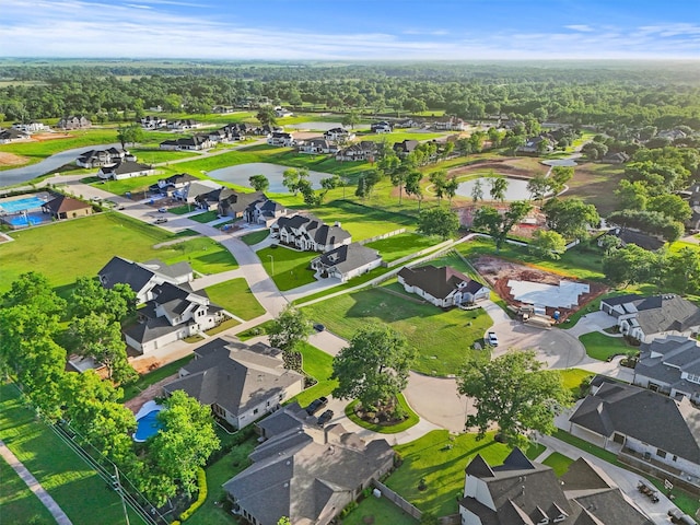 4215 Wooded Isle Way, Fulshear, TX 77441 - aerial overview of property's location with nearby suburban area and a large body of water