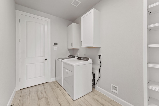 4215 Wooded Isle Way, Fulshear, TX 77441 - laundry area featuring cabinet space, washer and clothes dryer, and baseboards