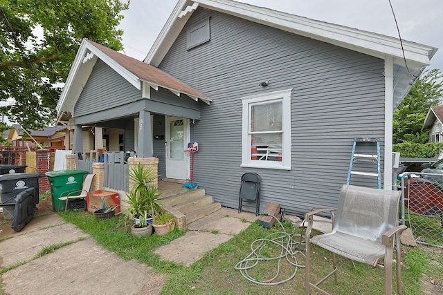 702 72nd St, Houston, TX 77011 - rear view of house featuring covered porch