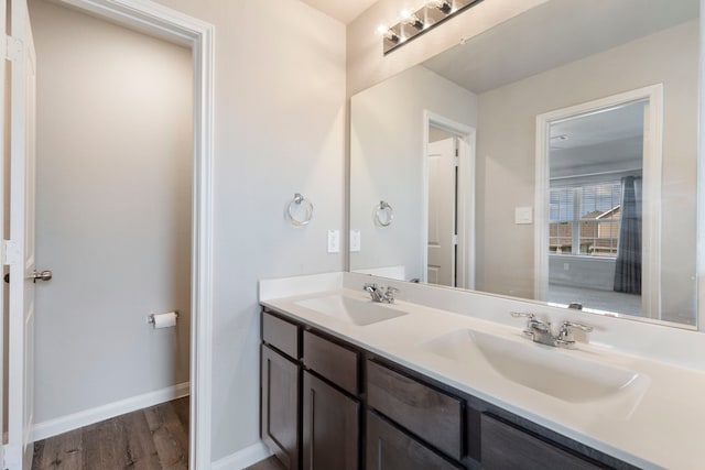 4438 Stephanie Park Ln, Conroe, TX 77304 - full bath featuring double vanity and wood finished floors