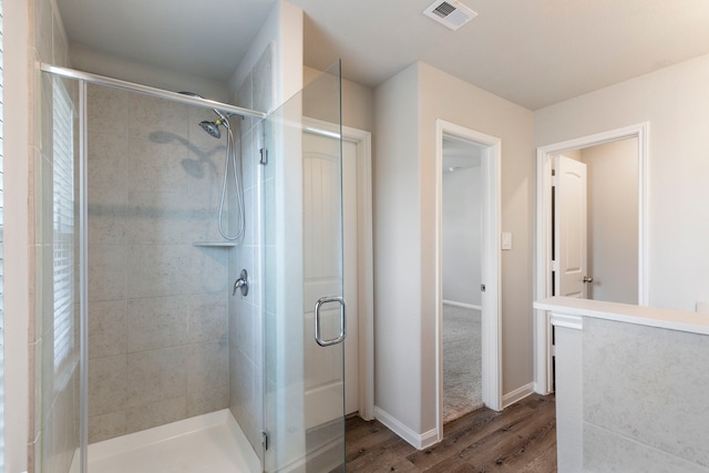 4438 Stephanie Park Ln, Conroe, TX 77304 - bathroom with wood finished floors and a stall shower