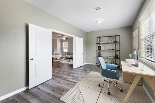 4438 Stephanie Park Ln, Conroe, TX 77304 - office area with wood finished floors and healthy amount of natural light