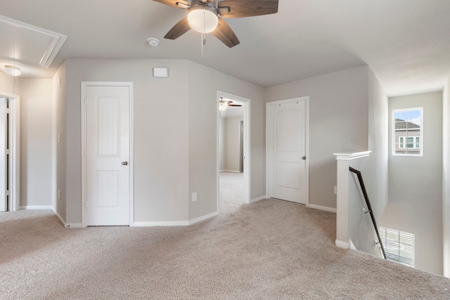 4438 Stephanie Park Ln, Conroe, TX 77304 - spare room featuring attic access, carpet flooring, a ceiling fan, and a smoke detector