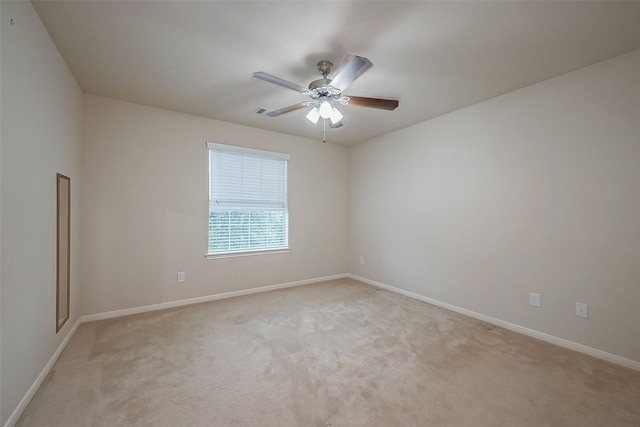13322 Mesquite Stone Ln, Richmond, TX 77407 - unfurnished room featuring light carpet, ceiling fan, and baseboards