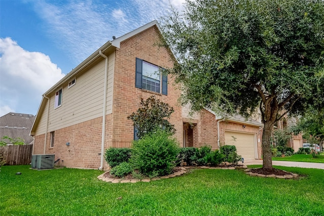 13322 Mesquite Stone Ln, Richmond, TX 77407 - view of front of house featuring brick siding, an attached garage, central AC, and concrete driveway