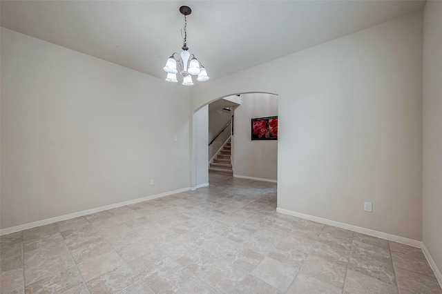 13322 Mesquite Stone Ln, Richmond, TX 77407 - unfurnished room featuring arched walkways, a chandelier, baseboards, stairs, and light stone finish floors