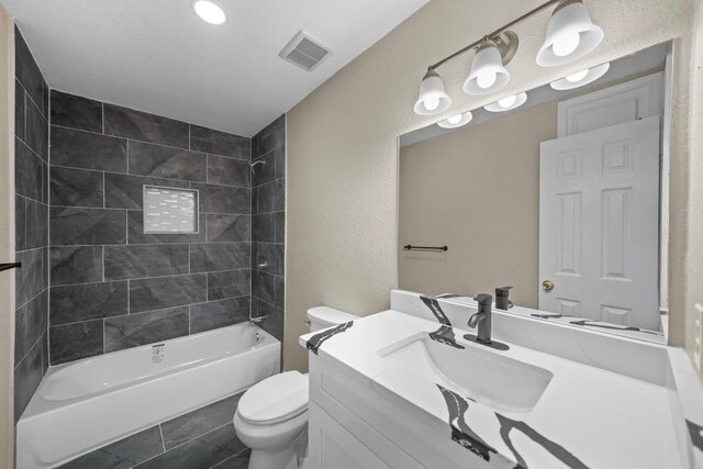 848 Nursery St, Clute, TX 77531 - full bathroom with toilet, vanity, shower / washtub combination, and a textured wall