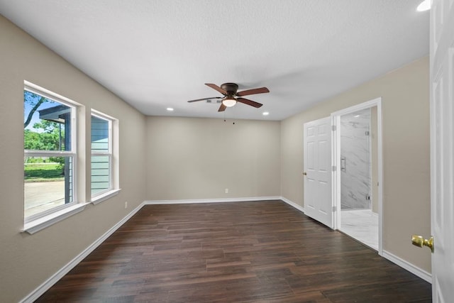 848 Nursery St, Clute, TX 77531 - unfurnished bedroom with dark wood-style flooring, baseboards, recessed lighting, connected bathroom, and a ceiling fan