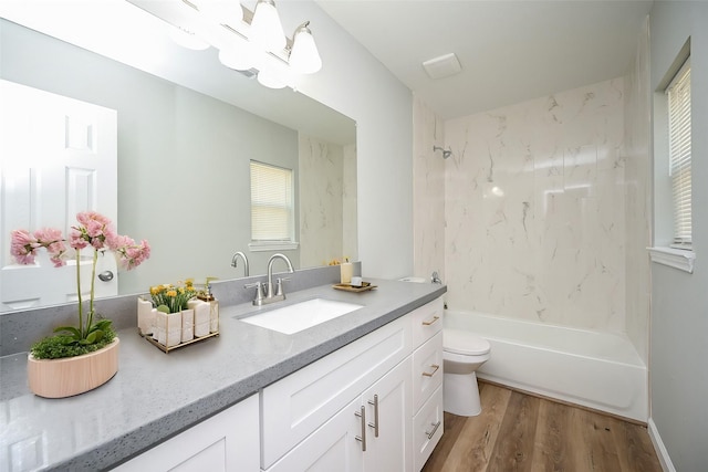 9510 Chesterfield Dr, Houston, TX 77051 - bathroom with vanity, toilet, wood finished floors, and bathing tub / shower combination