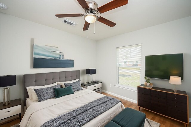 9510 Chesterfield Dr, Houston, TX 77051 - bedroom featuring wood finished floors, baseboards, and ceiling fan