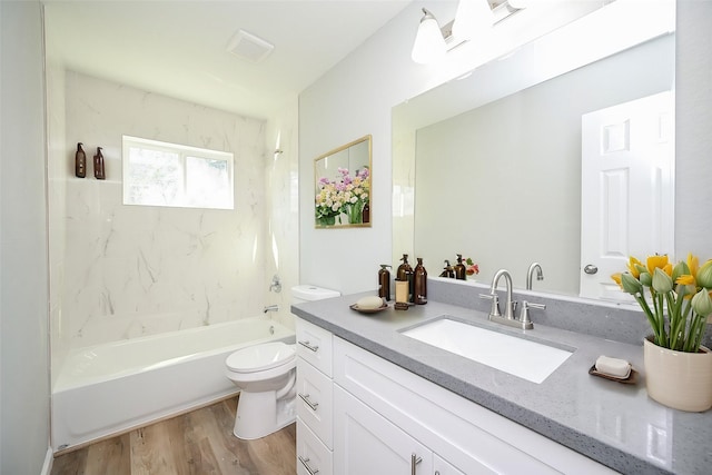 9510 Chesterfield Dr, Houston, TX 77051 - full bath with vanity, toilet, wood finished floors, and washtub / shower combination